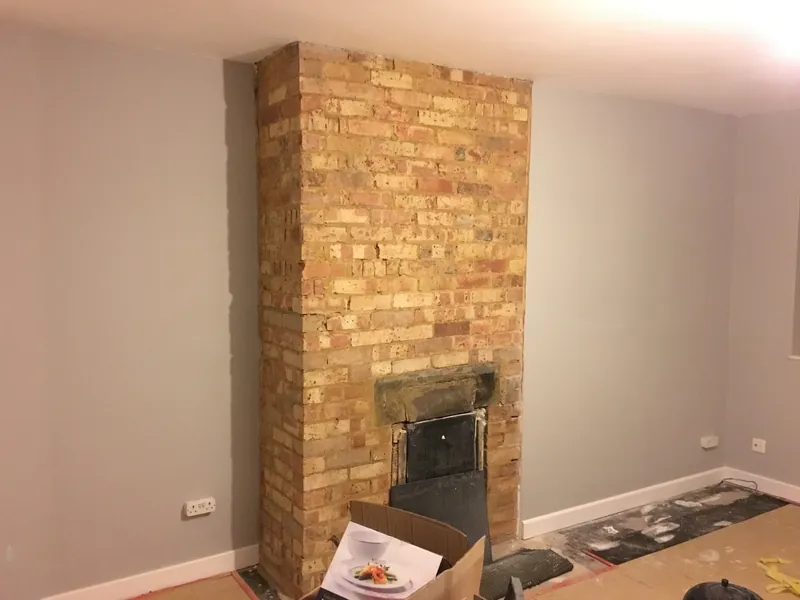 Exposed brick chimney breast renovation