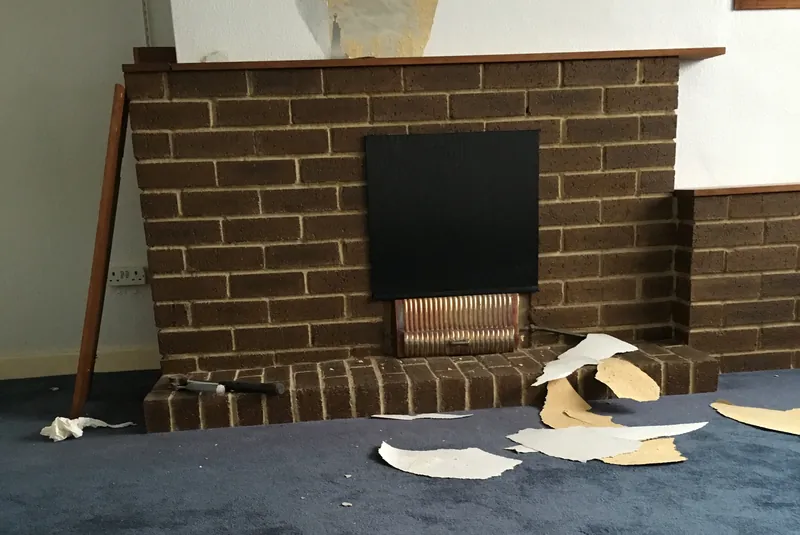Exposed brick chimney breast: Before: a dated brick fire surround