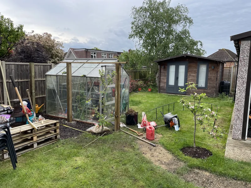 Garden makeovers & clearances: Before: an open garden around the greenhouse