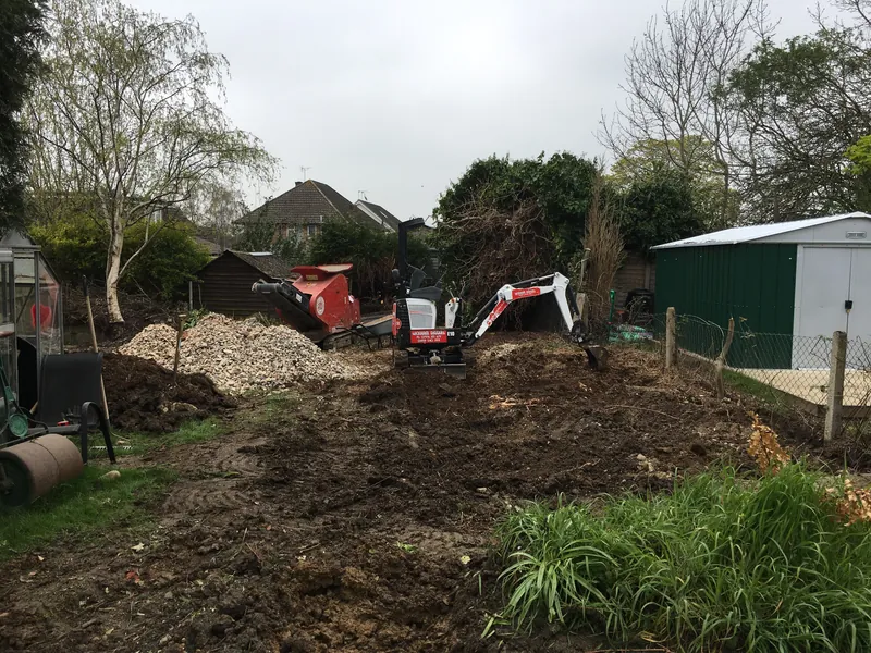 Garage foundations & concrete base: Site cleared and digging started with a mini digger