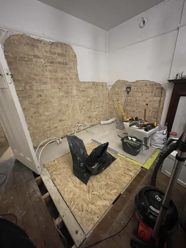 Structural floor repair & new floorboards: Before: the old floor lifted for inspection