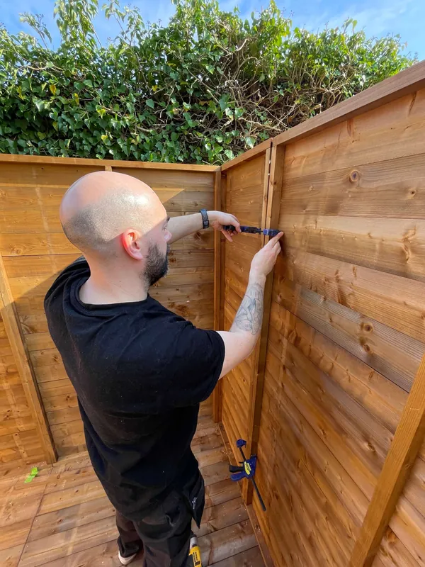 Fixing timber cladding on a garden building