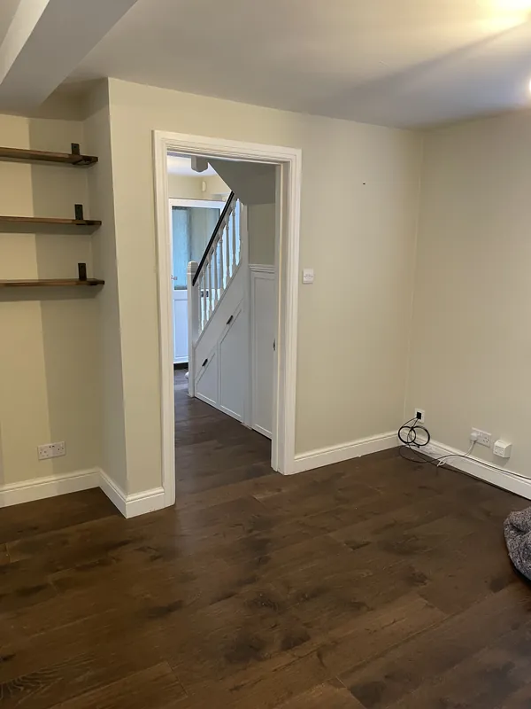 Renovated room with new flooring, skirting boards and architraves